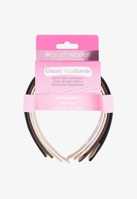 Klassiske hovedbånd i sort, brun, beige og creme. Glat tekstur med et let design, pakket på et lyserødt hængende kort.