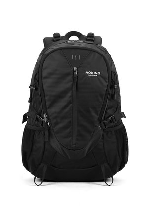 Zaino nero realizzato in tessuto testurizzato, con diverse zip, spallacci regolabili, tasche laterali in rete e dettagli riflettenti.