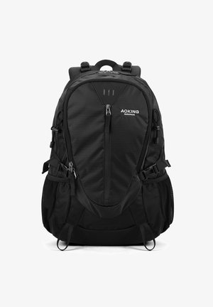 Sac à dos noir en tissu texturé, doté de plusieurs zippers, de bretelles réglables, de poches latérales en maille et d'accents réfléchissants.