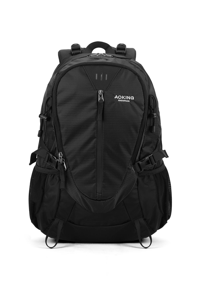 Zaino nero realizzato in tessuto testurizzato, con diverse zip, spallacci regolabili, tasche laterali in rete e dettagli riflettenti.