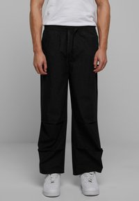 WIDE - Jogginghose - black