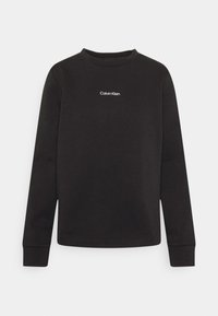 Černá mikina z bavlněné směsi s kulatým výstřihem a dlouhými rukávy, s bílým logem „Calvin Klein“ na přední straně.