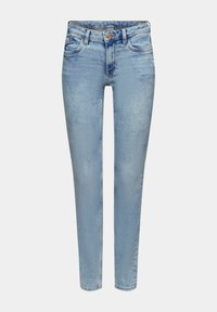 Jean skinny taille haute bleu clair avec fermeture par bouton et zip, poches avant et arrière, et détails subtilement délavés.