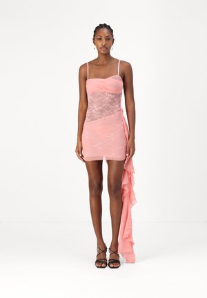 Pink mini dress with a sheer lace bodice, ruched detailing, and an asymmetrical chiffon overlay. Adjustable thin straps and fitted silhouette.