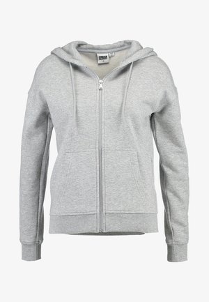 Pelēks zip-up kapuce, izgatavota no mīksta kokvilnas maisījuma. Tam ir oderēta kapuce, divas priekšējās kabatas un ribotas piedurknes un apakšmalā.