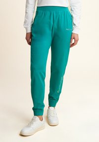 Freddy CON ELASTICO SUL E DETTAGLI FLOREALI - Pantalones deportivos - greenlake