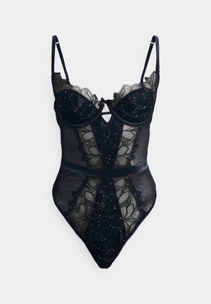 Black sheer bodysuit featuring scalloped edges, intricate floral embroidery, underwire cups, adjustable straps, and a defined waistline.