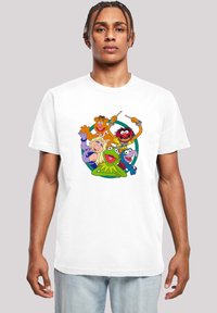 Hvit bomulls t-skjorte med fargerike tegneseriefigurer, inkludert Kermit, Miss Piggy og Animal, illustrert i et sirkulært design.