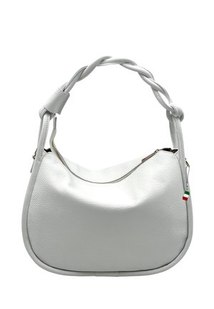 White leather handbag with twisted handle, curved bottom, zipper closure, and small Italian flag tag on the side.