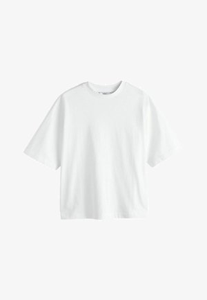 Valkoinen puuvillainen t-paita, jossa on pyöreä kaula-aukko, lyhyet hihat ja rento leikkaus. Tasainen rakenne ilman kuvioita tai yksityiskohtia.