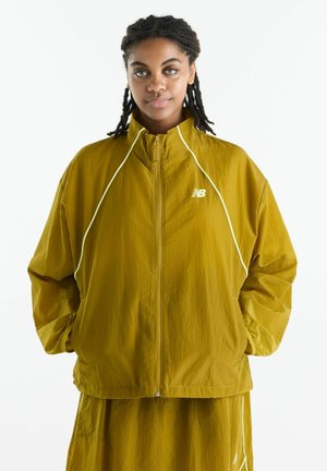 New Balance, SPORT LEGACY JACKET - Übergangsjacke - mustard yellow
