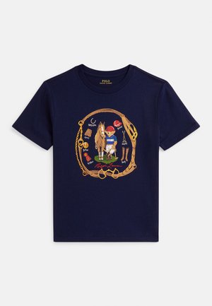 Navy blue cotton t-shirt featuring an illustration of a child with a horse, surrounded by equestrian gear, in multicolor print.