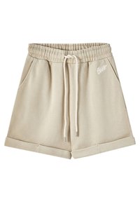 Shorts en coton beige avec une taille élastique, cordon de serrage, deux poches latérales et ourlet replié. Présente un logo blanc à l'avant.