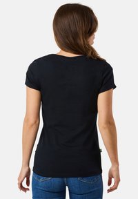 Black short-sleeve t-shirt with a round neckline, made of smooth fabric. Features minimal design and tag on the bottom left.