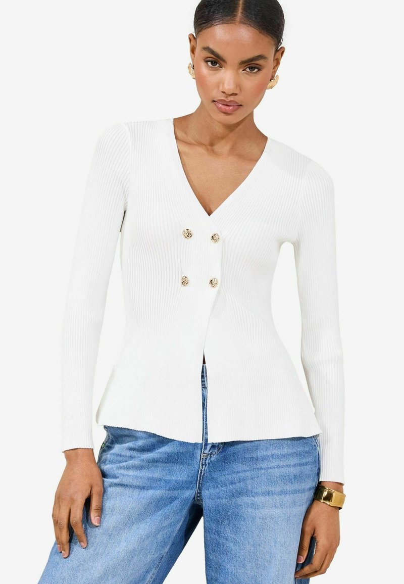 Cardigan alb cu manșete lungi, cu decolteu în V, având un design dublu cu nasturi aurii și un tiv evazat.