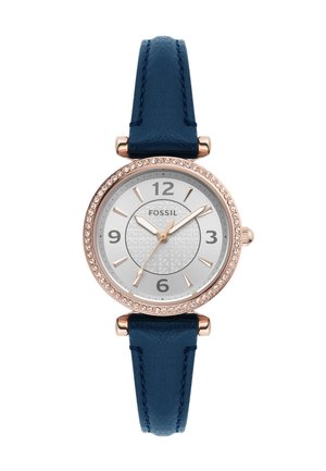 Montre Fossil avec un cadran en or rose, un visage argenté, un bracelet en cuir bleu marine, de forme ronde et des accents scintillants autour du cadran.
