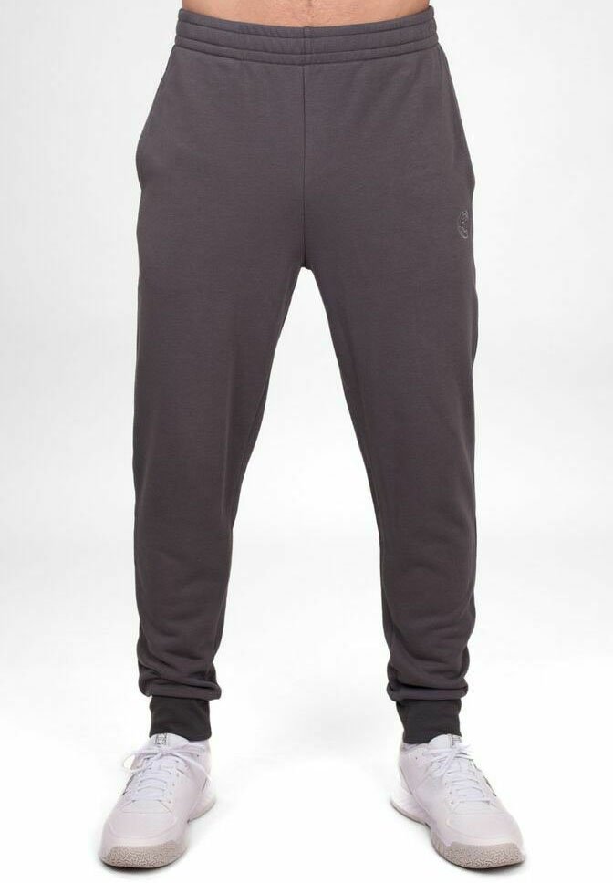 Grijze joggingbroek met een taps toelopend ontwerp, elastische tailleband en ribgebreide boorden. Beschikt over een subtiele logo aan de zijkant en een zachte, gestructureerde stof.