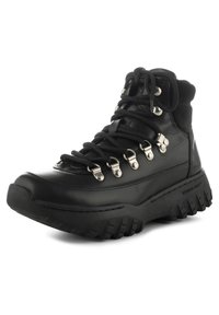Scarpe da trekking nere con una tomaia in pelle resistente, suola spessa in gomma, occhielli in metallo e superficie testurizzata per grip e supporto.