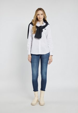 - Jeansy Skinny Fit