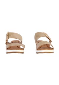 Sandalias beige con dos correas ajustables, un sutil detalle de hebilla, una plantilla acolchada y una suela intermedia blanca con un ligero tacón.