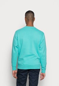 Nike Sportswear CRW - Sweatshirt com capuz - washed teal/white