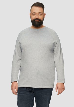 Sweatshirt beige clair à manches longues avec un col rond et une coupe décontractée, fabriqué en tissu doux, avec des poignets côtelés et un ourlet droit.