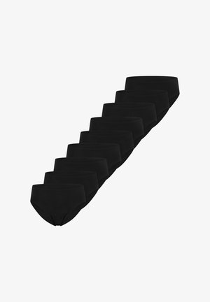 Dix sous-vêtements noirs unis de style slip disposés en diagonale sur un fond blanc.
