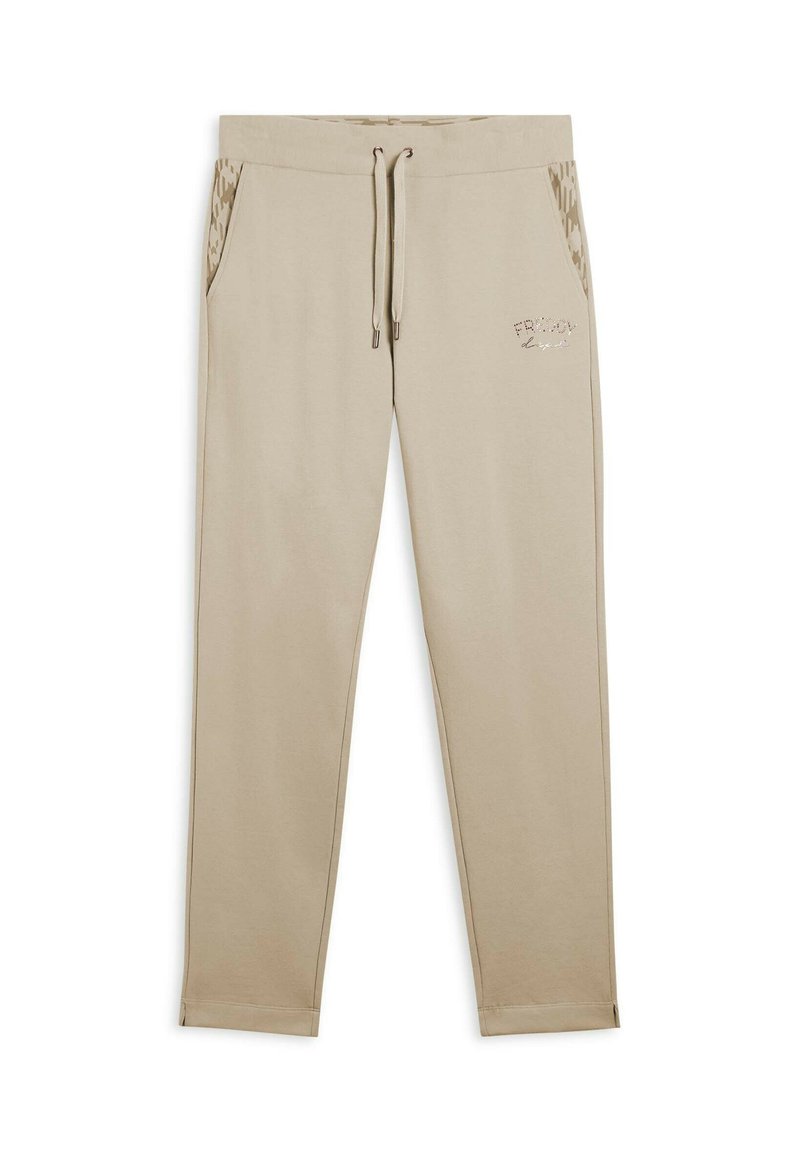 Pantalones de chándal beige con cintura elástica y cordón ajustable. Los bolsillos laterales tienen un borde con patrón. Logo sutil en la parte frontal.