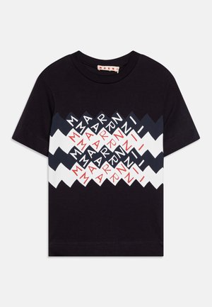 Black cotton t-shirt featuring a zigzag design with multicolored text in red, white, and navy blue. Short sleeves and a round neckline.