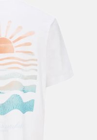 White t-shirt featuring a graphic print of a sun and waves in orange, light blue, and navy. Soft cotton material, short sleeves.