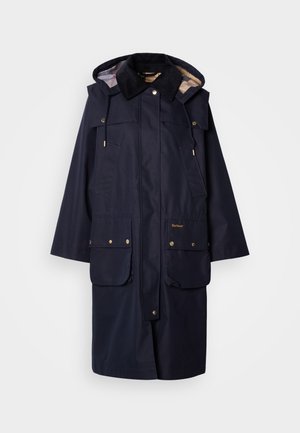 Granatowa wodoodporna parka z kapturem, z złotymi elementami metalowymi, dwoma przednimi kieszeniami i podszewką w kratę. Posiada regulowany sznurkiem dekolt.