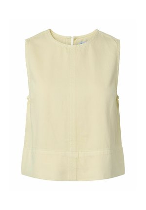 Haut court sans manches, beige clair, avec encolure ronde et fermeture éclair au dos, présentant un détail simple de couture au centre.