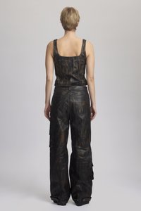 Black leather crop top and cargo pants, featuring a brushed texture with brown streaks, wide legs, and side pockets.