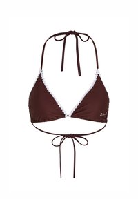 Pruun bikiinivöö, millel on valged lainelised ääred, kolmnurkne tass ja reguleeritavad sidemed kaela ja selja taga. Materjal on sile ja veniv.