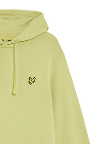 Ljusgrön hoodie med en känguruficka, prydd med en svart broderad logotyp på vänster sida. Mjuk tygkänsla.