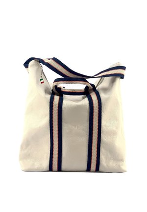 Cream leather handbag with navy and white striped fabric handles and shoulder strap, and a small Italian flag zipper pull.