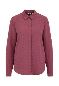 Chemise à manches longues en rose foncé, dotée d'un tissu texturé avec des motifs de points en relief, d'un col à boutons et d'une coupe droite.