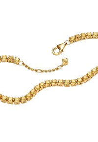 Goldfarbener Armreif mit gelben Steinen, verknüpftes Design, Karabinerverschluss und verstellbare Kette zur Sicherung. Glatte und glänzende Oberfläche.