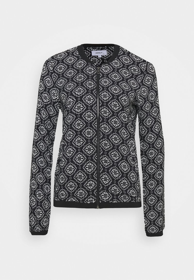 Veste noire zippée à manches longues avec motifs géométriques blancs en forme de losanges et col, poignets et ourlet noirs unis.
