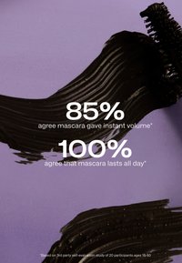 Brush strokes of black mascara on purple background with text showing 85% instant volume and 100% all-day lasting claims.