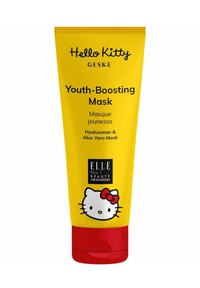 Gele buisverpakking van de Hello Kitty Youth-Boosting Masker met een rode dop. Heeft een cartoon kattenlogo en tekst die belangrijke ingrediënten en het merk beschrijft.