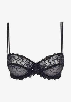 Reggiseno in pizzo nero con ricami floreali, coppe con ferretto, spalline regolabili, fiocco decorativo al centro e bordo in pizzo ondulato lungo i lati.