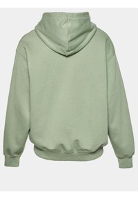 Haut à capuche vert clair avec une poche kangourou, tissu texturé, poignets et ourlet à côtes, offrant une capuche spacieuse pour un confort accru.