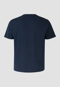 T-shirt bleu marine uni à manches courtes, vu de dos avec un col rond, sur un fond gris.