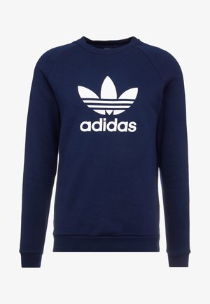 Sweat-shirt bleu marine à manches longues avec logo Adidas trèfle blanc et texte centré sur la poitrine, col rond et poignets côtelés.