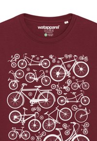 T-shirt bordeaux avec un design graphique blanc représentant diverses silhouettes de bicyclettes de tailles et styles différents, incluant des détails tels que les roues et les guidons.