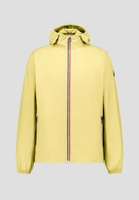 Lichtgele windjack met capuchon en elastische manchetten. Voorzien van een ritssluiting aan de voorkant met een rode en blauwe streep. Twee zijzakken.