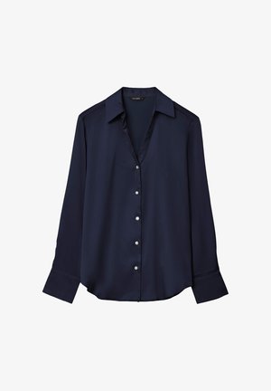 Blouse bleu marine à manches longues avec boutons, col pointu et poignets larges, présentée sur fond blanc.