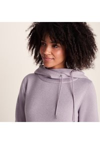 Light purple hoodie with a cowl neckline and drawstrings. Made from a textured fabric, featuring a relaxed fit and long sleeves.