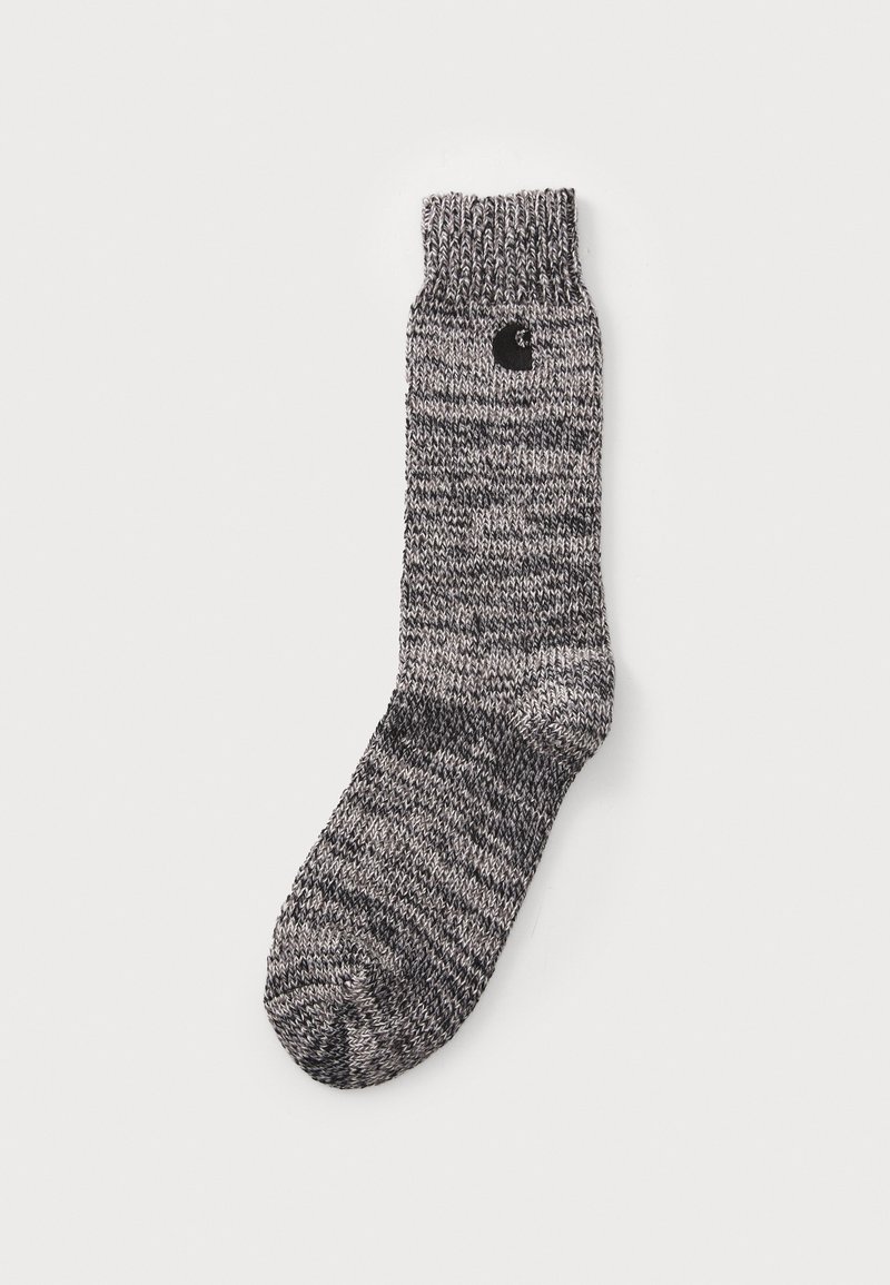 Gray and black knit sock with ribbed cuff, featuring a small black logo on the side. Textured fabric with a blended pattern.